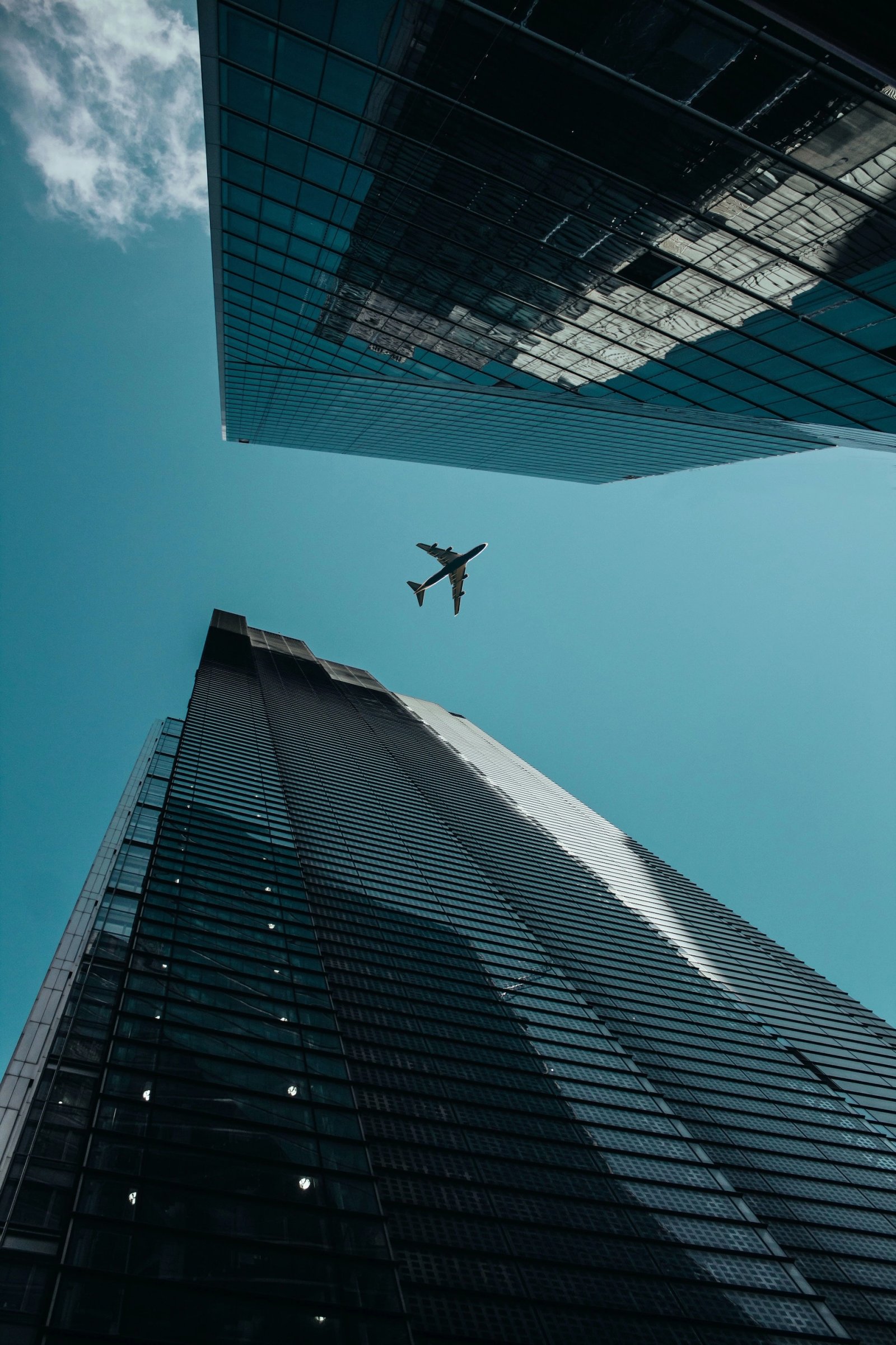 Aircraft flying above a global business district